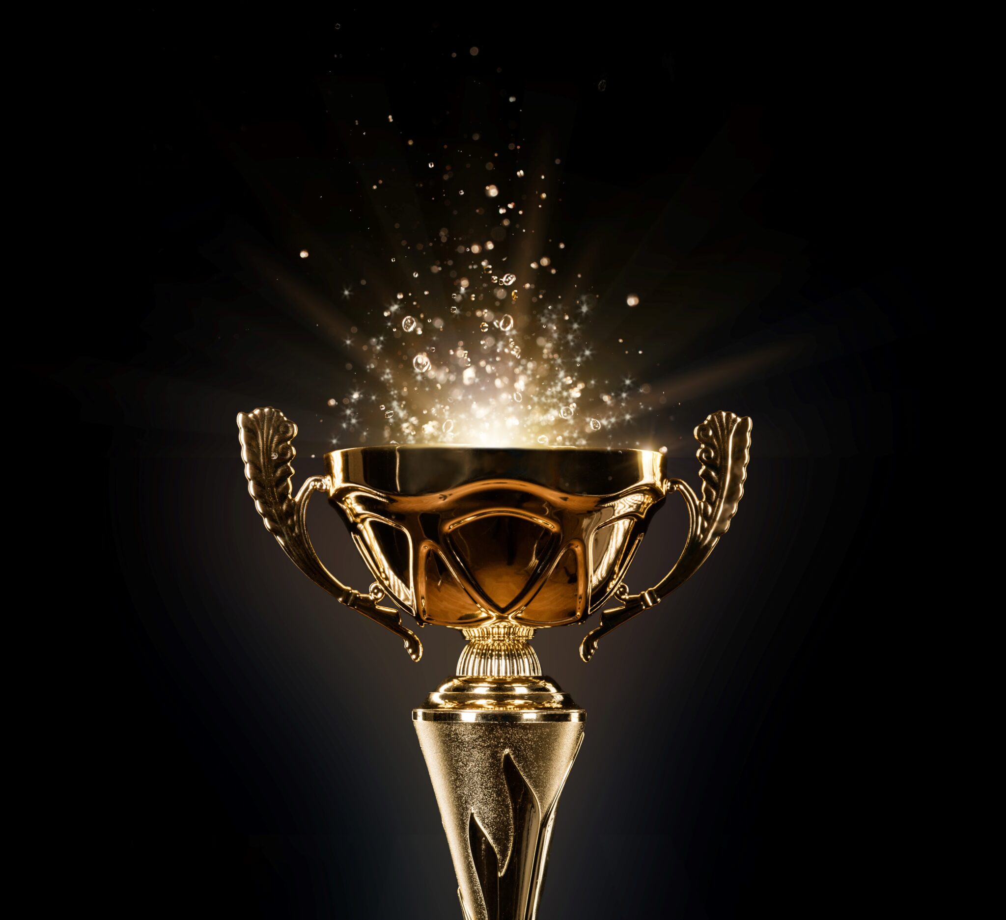 Announcing the award winners. Image of champion golden trophy on black background.